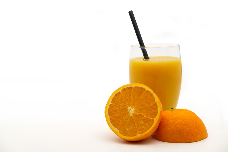Immobilized biocatalysts for debittering citrus juices
